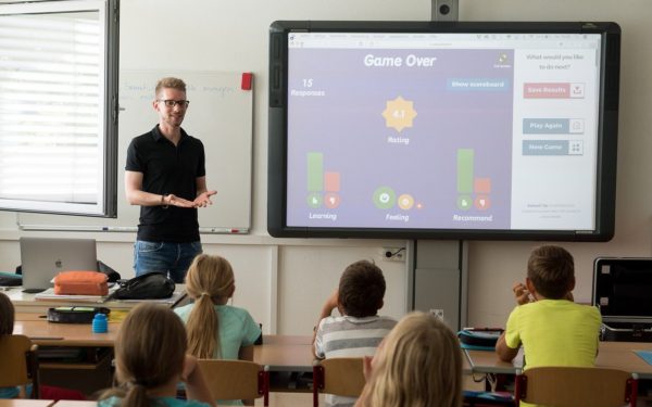 teacher-standing-in-front-of-classroom