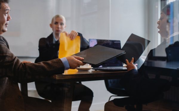 three-people-in-a-business-meeting