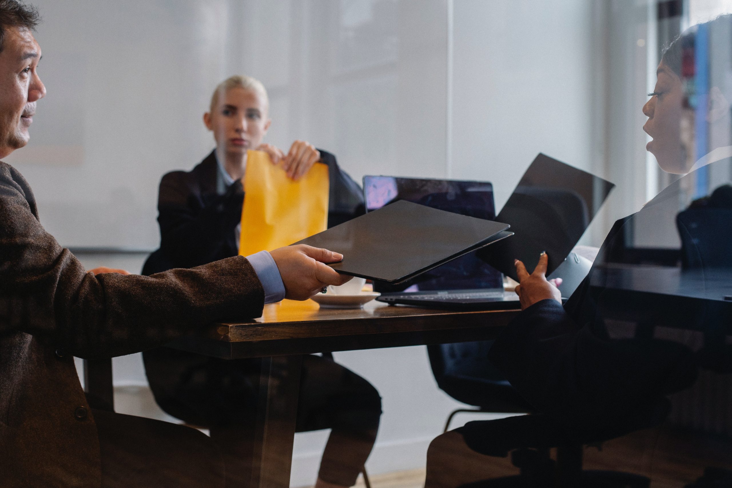 three-people-in-a-business-meeting