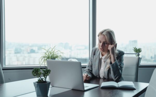 woman-sitting-at-desk-on-video-call