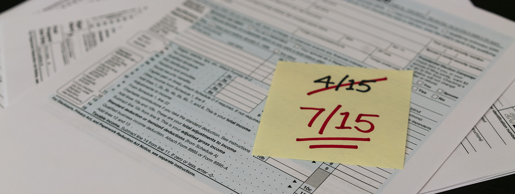 post-it-note-with-4/15-crossed-out-7/15-written-underneath