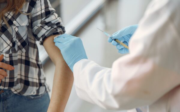 Doctor-giving-patient-vaccination-in-arm