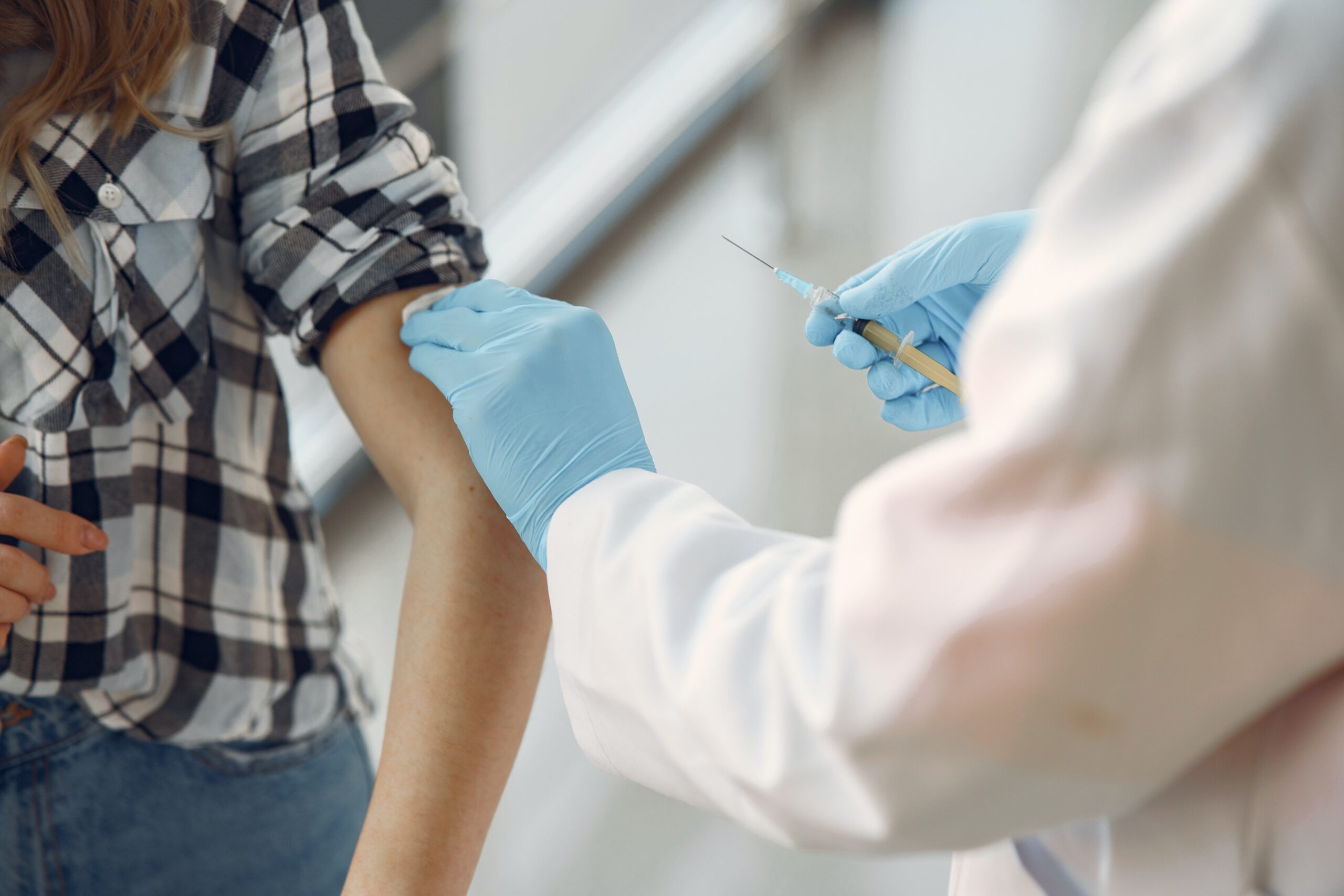 Doctor-giving-patient-vaccination-in-arm