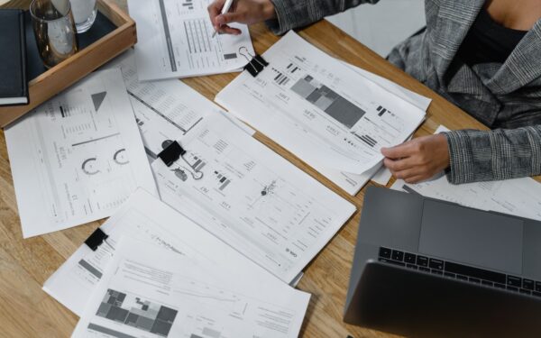 woman-sitting-at-desk-reviewing-business-reports