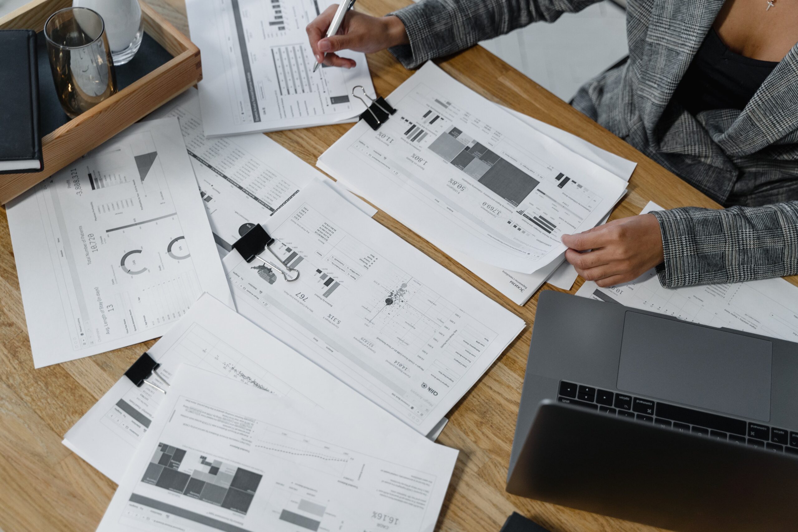 woman-sitting-at-desk-reviewing-business-reports