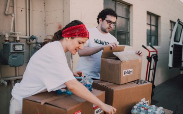 woman and man volunteering at food bank