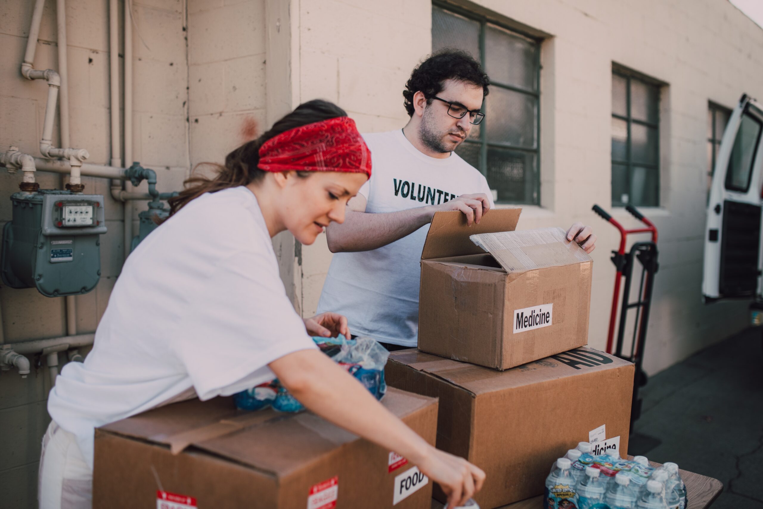 woman and man volunteering at food bank