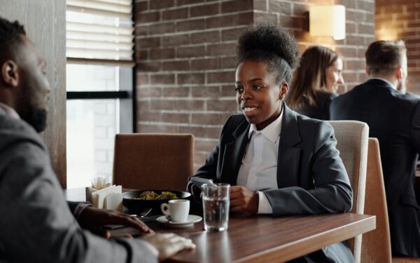 Woman and man having a business lunch at a restaurant