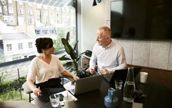 man and woman having a meeting