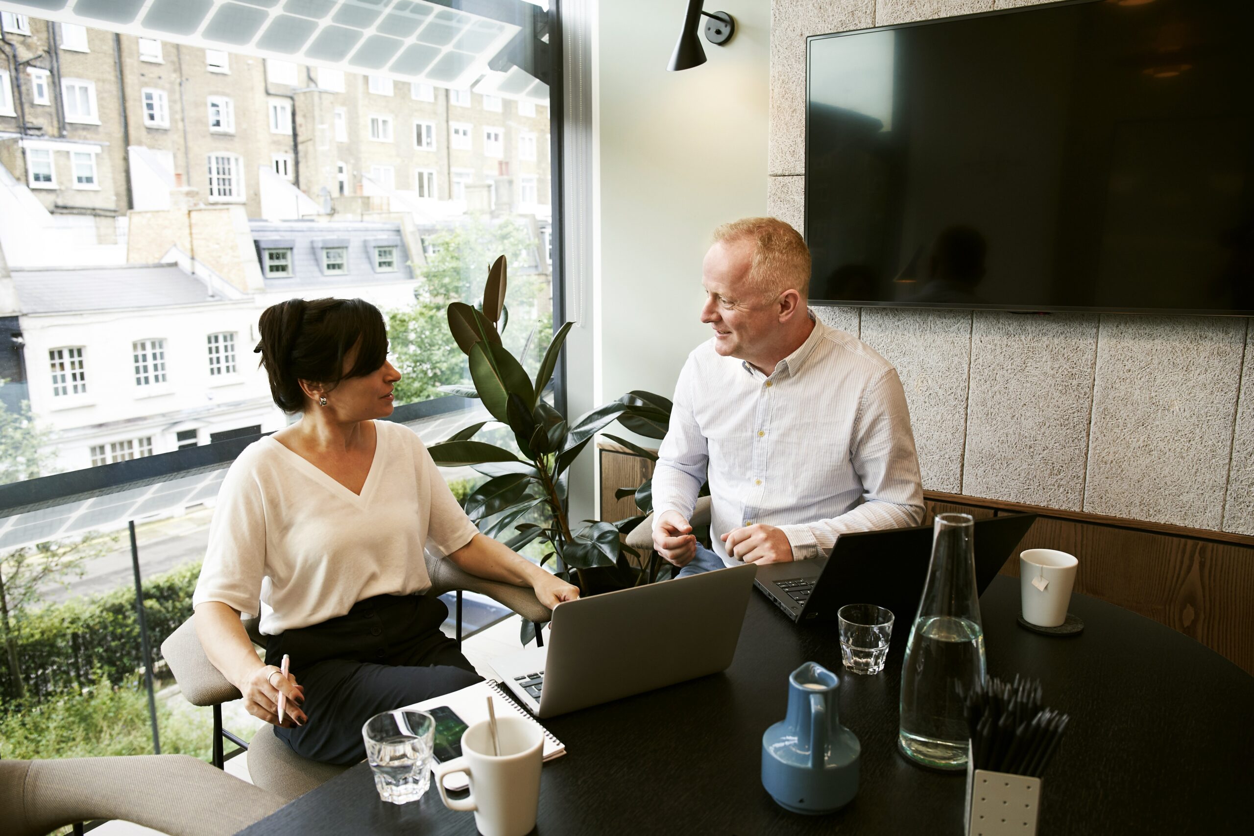 man and woman having a meeting