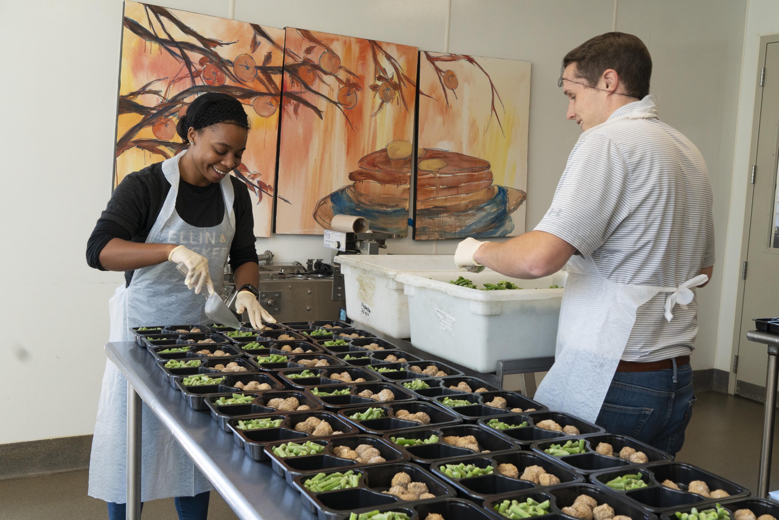 Ellin & Tucker employees volunteering in a kitchen