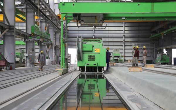 People Stands Near Green Metal Industrial Machine